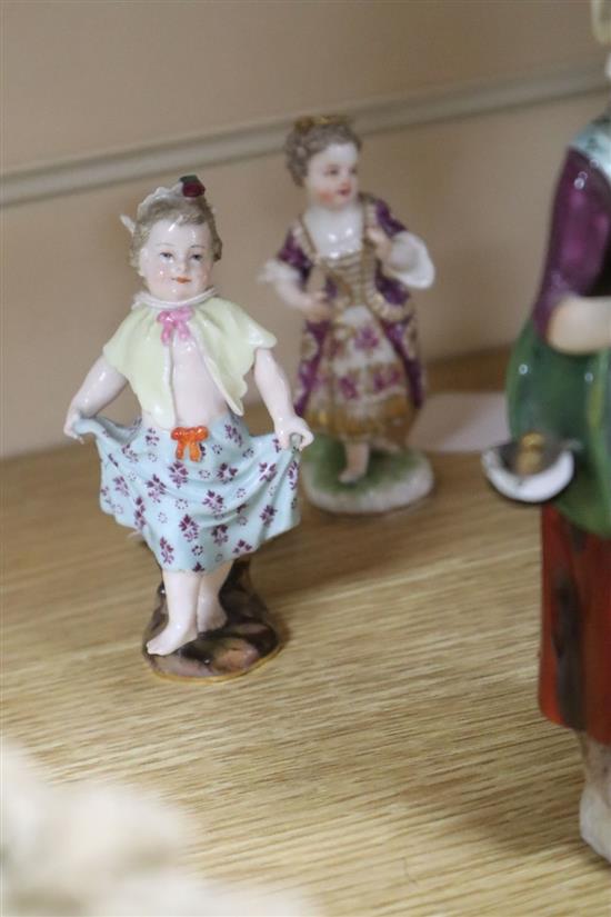 A Continental jointed porcelain figure of a ballerina on stand, a late Meissen figure of a dancer and ten other figures, tallest 32.5cm